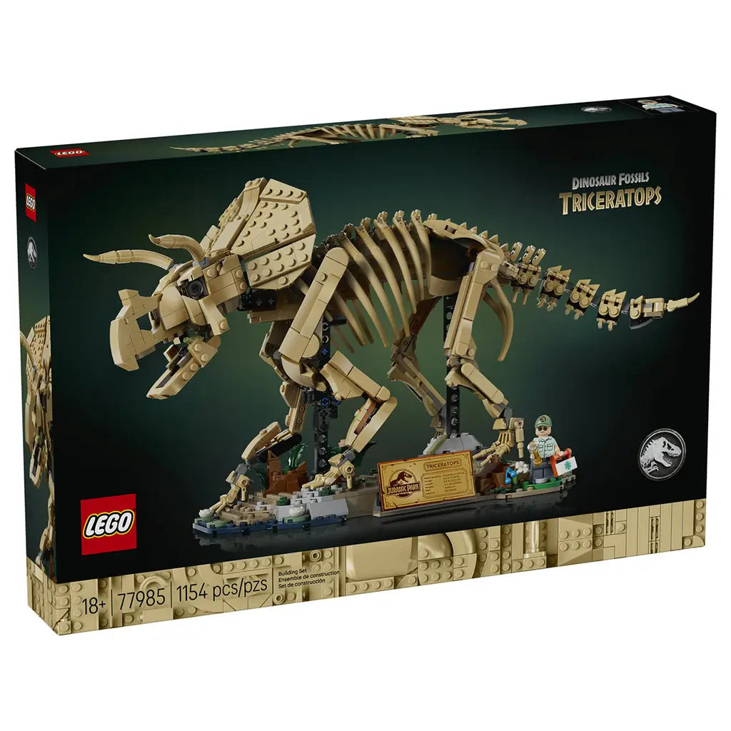 LEGO Jurassic World Triceratops 77985 box has black and tan cardboard packaging showing the brick-built fossil skeleton, display base, 1,154-piece count and 18+ age mark.