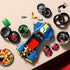 LEGO Mario Kart building set shows green, blue, yellow and black plastic pieces, wheel components and kart body sections arranged for assembly on a tabletop with parts bowls and accessories nearby.