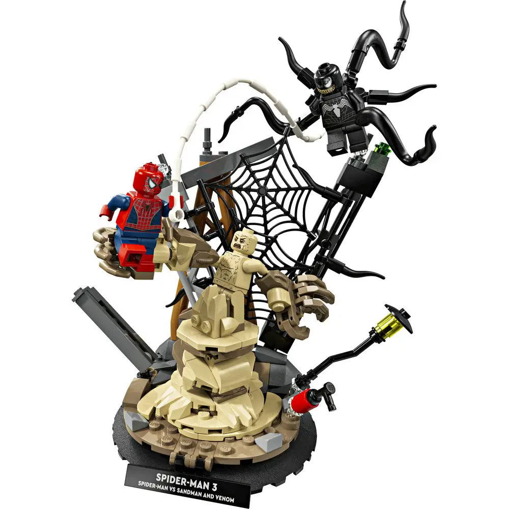 LEGO Marvel Spider-Man 3 display model in tan, black, red, and blue plastic showing Spider-Man battling Sandman and Venom, with textured sand sculpture, web elements, twisting tentacles, and a round display base.