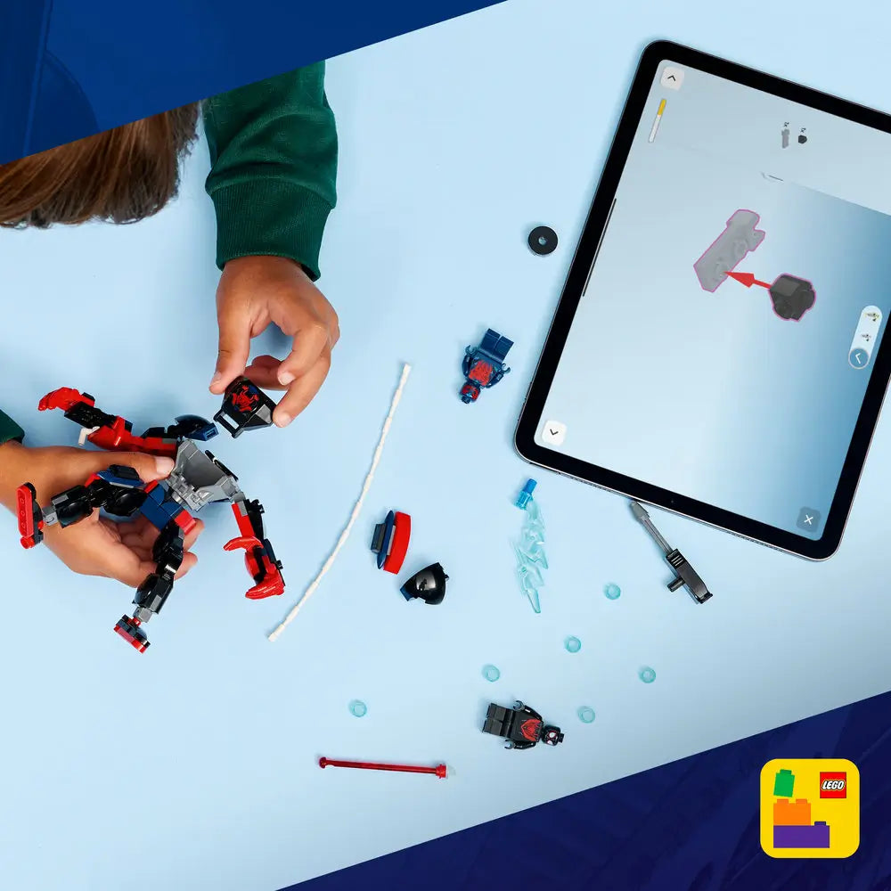 LEGO Marvel Spider-Man building set shown in use, with red and black plastic mech parts scattered on a light blue surface beside a tablet displaying digital instructions, highlighting interactive guided building play.