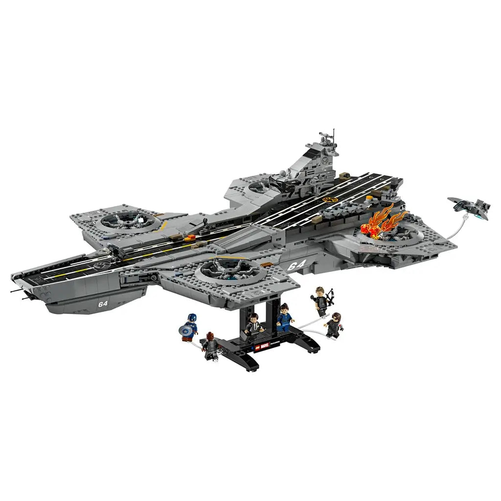 LEGO Marvel S.H.I.E.L.D. Helicarrier building set, gray plastic aircraft-carrier model with detailed flight deck, rotor platforms, minifigures and display stand on a light gray background.