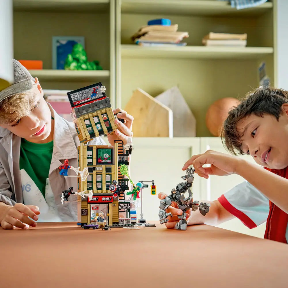 LEGO Marvel Daily Bugle lifestyle builder scene shows two children posing Spider-Man and villains around the assembled building, highlighting interactive play and modular floor sections.