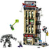 LEGO Marvel Daily Bugle modular building features tan and dark gray plastic walls, stacked rectangular floors, and detailed city elements, showing Spider-Man battling villains around the iconic newspaper headquarters.