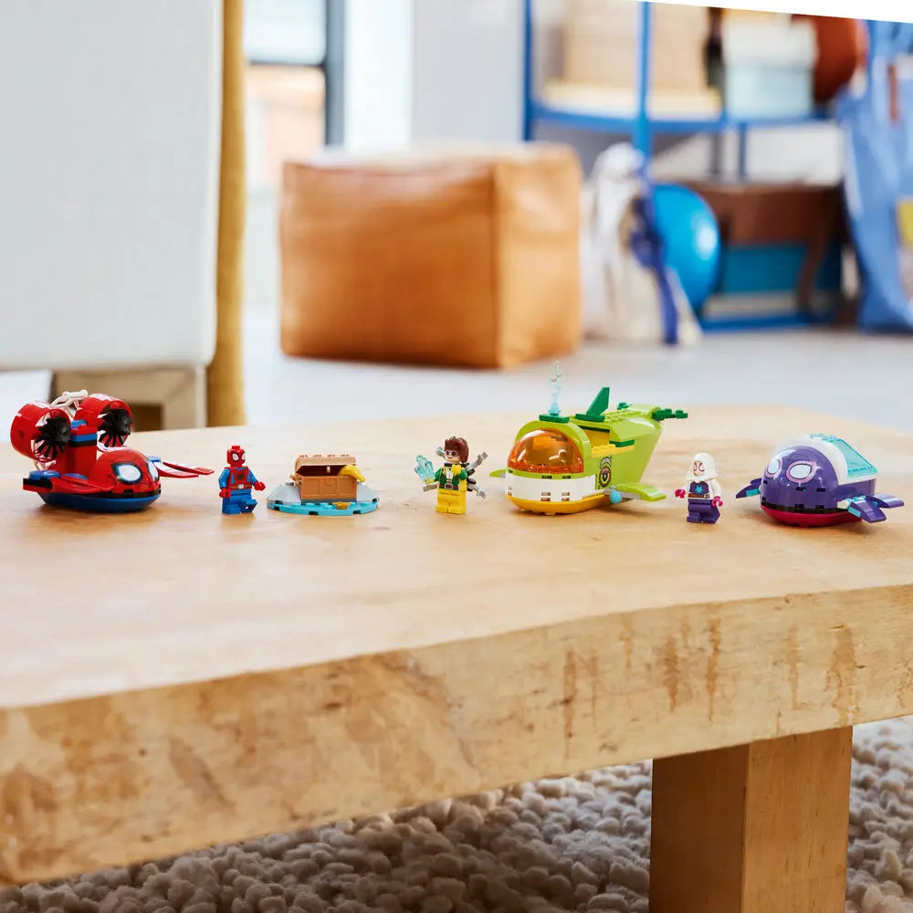 LEGO Marvel Spidey underwater vehicles displayed shows completed mini submarines and characters lined up on a tabletop, emphasizing bright colors, simple builds, and collectible superhero play appeal.