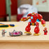 LEGO Marvel Ultron vs. Iron Man set in red, gold, gray, and pink plastic is displayed on a table with the large Iron Man mech, Ultron flying craft, and two figures.