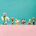 LEGO Minecraft Chicken Jockey Desert Attack figures feature a white Iron Golem, tan villager and rabbit, white chicken, gray wolf and tan baby zombie on a pink shelf.