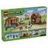 LEGO Minecraft Evoker Village Attack set 21596 box back in green shows brown village buildings, an iron golem, villagers, animals and illustrated action play features.