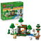 LEGO Minecraft First Night Adventure set 21593 pairs its green product box with a brick forest shelter, Alex, Creeper, skeleton, sheep, rabbit and wolf on white.
