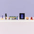 LEGO Minecraft Nether & End Portal Journey display showing completed plastic brick portal and platform in black, purple, tan, and gray, cubic block design for play and display, lined up neatly on a clean surface.