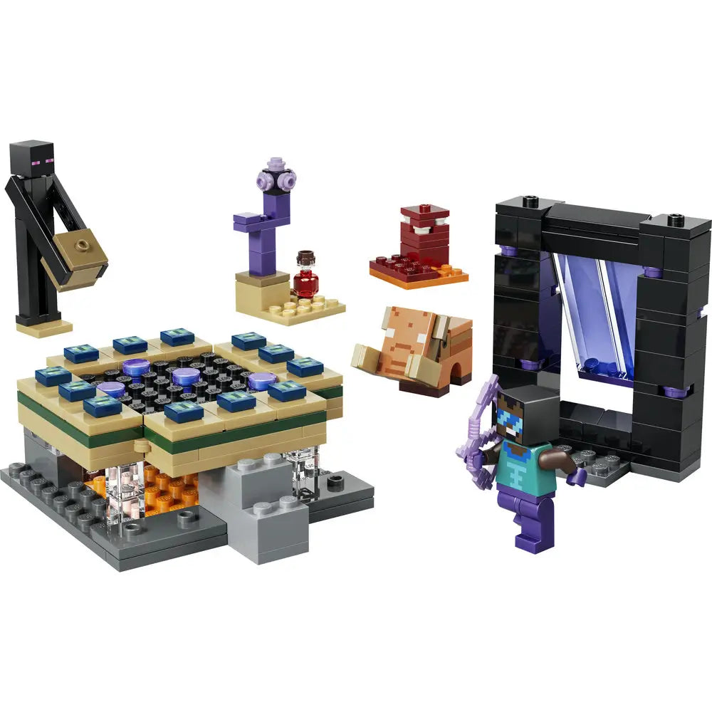 LEGO Minecraft Nether & End Portal Journey set featuring multicolored plastic brick terrain with blue, tan, and gray textures, blocky cubic form for imaginative play, showing a portal platform, Enderman figure, and accessories on a display base.