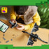 LEGO Minecraft The Ender Dragon build in black and gray bricks lies on a table as a child assembles its display stand beside loose pieces and digital instructions.