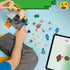 LEGO Minecraft Zombie Dungeon building activity shows a child assembling the tan and gray brick desert dungeon on a light blue surface, with loose character pieces, accessories, and digital instructions displayed on a tablet.