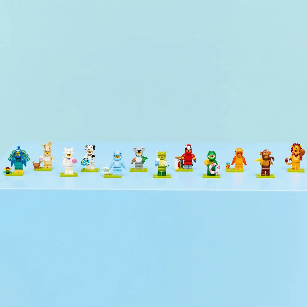 LEGO Minifigures Series 28 animal costume characters displayed in a neat row on green base plates against a blue background, showcasing the full collectible lineup.