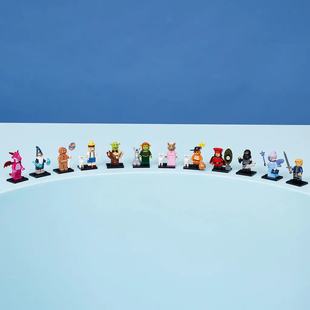 LEGO Shrek minifigures form a colorful row of 12 collectible fairy-tale characters with small accessories and black display bases on a curved light blue surface.