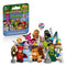 LEGO Shrek Minifigures 71053 set shows the green and blue mystery box beside a colorful lineup of 12 collectible fairy-tale characters and accessories on white.