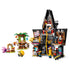 LEGO Despicable Me 4 set in gray, black, green and yellow plastic bricks shows Gru’s open mansion laboratory, treehouse, zip line, Minions and family figures on white.
