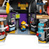 LEGO Despicable Me 4 laboratory interior in gray, black and purple plastic features a yellow Minion between control screens, pipes, a blue tank and equipment.