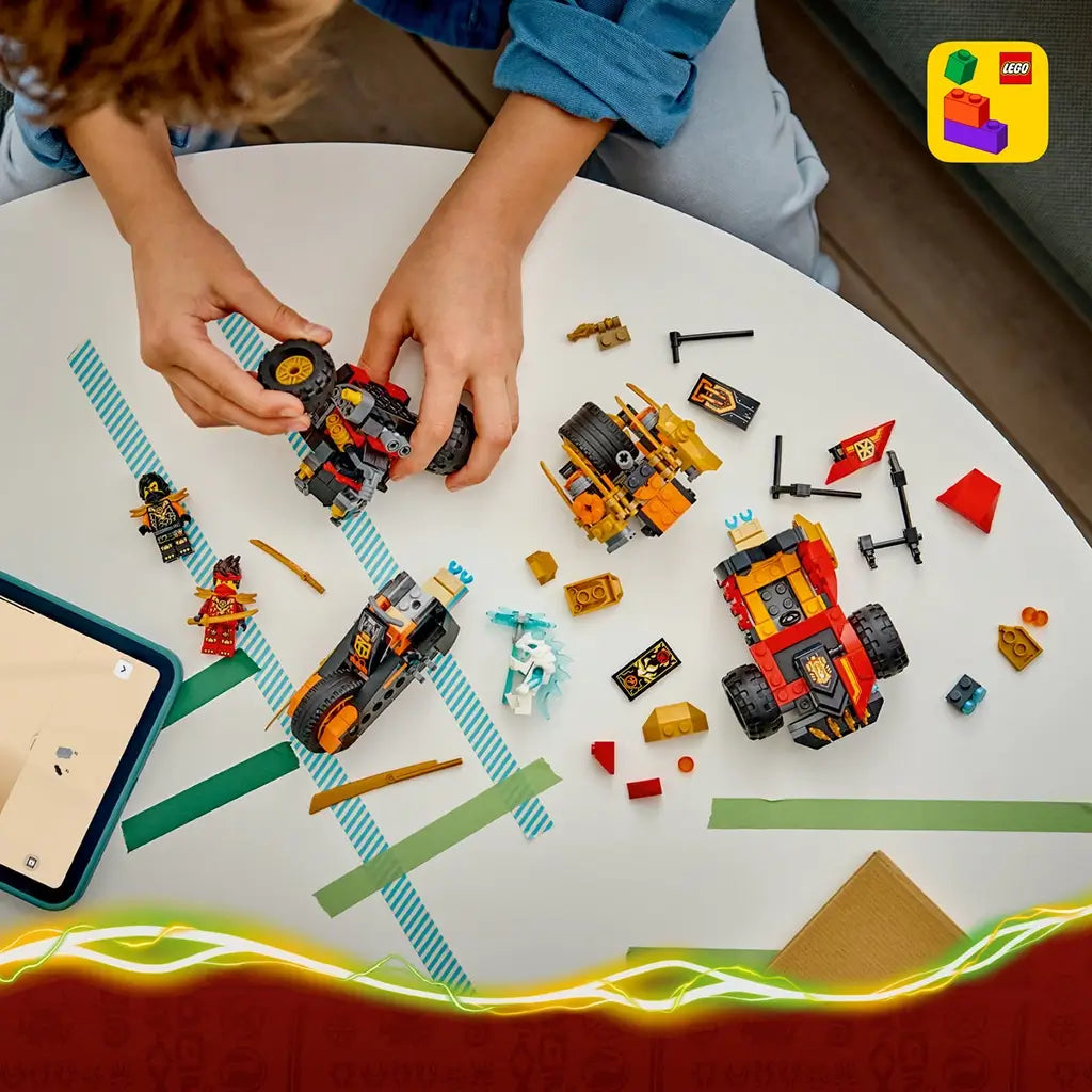 LEGO NINJAGO vehicle set in red, black and gold plastic is spread across a white table as a child builds the buggy and motorcycle beside a tablet with instructions.