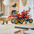 LEGO NINJAGO Land Bounty in red, black and gold plastic forms a six-wheel vehicle topped by a ship, with minifigures posed around it on a light wood tabletop.