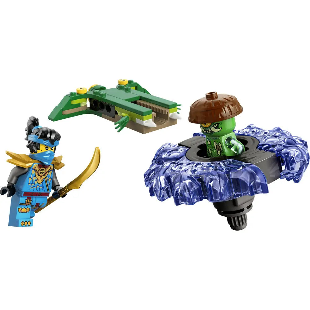 LEGO NINJAGO spinner toy shows blue and translucent purple plastic spinner with a green mutation monster minifigure emerging from the center, plus a blue ninja holding a gold sword on a clean white background.