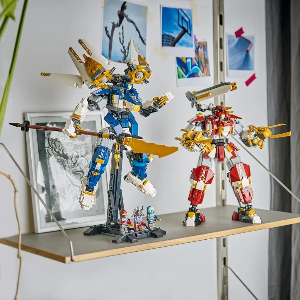 LEGO NINJAGO Twin Titan Mechs in red, blue, white and gold plastic stand on a shelf, with the blue mech on a display stand and three minifigures arranged below.