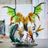 LEGO NINJAGO Ultra Dragon Battle in gold, white, green and black plastic features a four-headed winged dragon fighting a giant serpent with ninja minifigures on a tabletop.