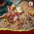 LEGO NINJAGO dragon set in red, gold and black plastic is spread across a rustic wood table as a child builds beside a tablet displaying digital building instructions.