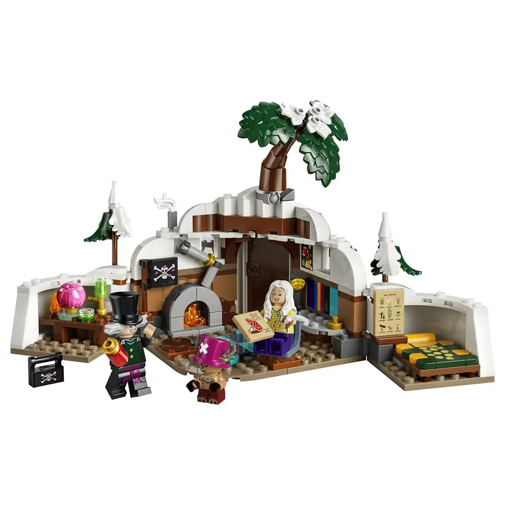 LEGO One Piece Dr. Hiriluk's Hideout set in white, brown and green plastic features a snowy cave room, flowering tree, fireplace, bed and three minifigures.