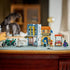 LEGO One Piece display in gray, tan, orange and green plastic features the Recruitment Center, motorcycle, market stall and four minifigures arranged on a tabletop.