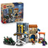 LEGO One Piece Showdown with Captain Smoker set in gray, tan and green plastic is displayed with its retail box, Recruitment Center, motorcycle and four minifigures.