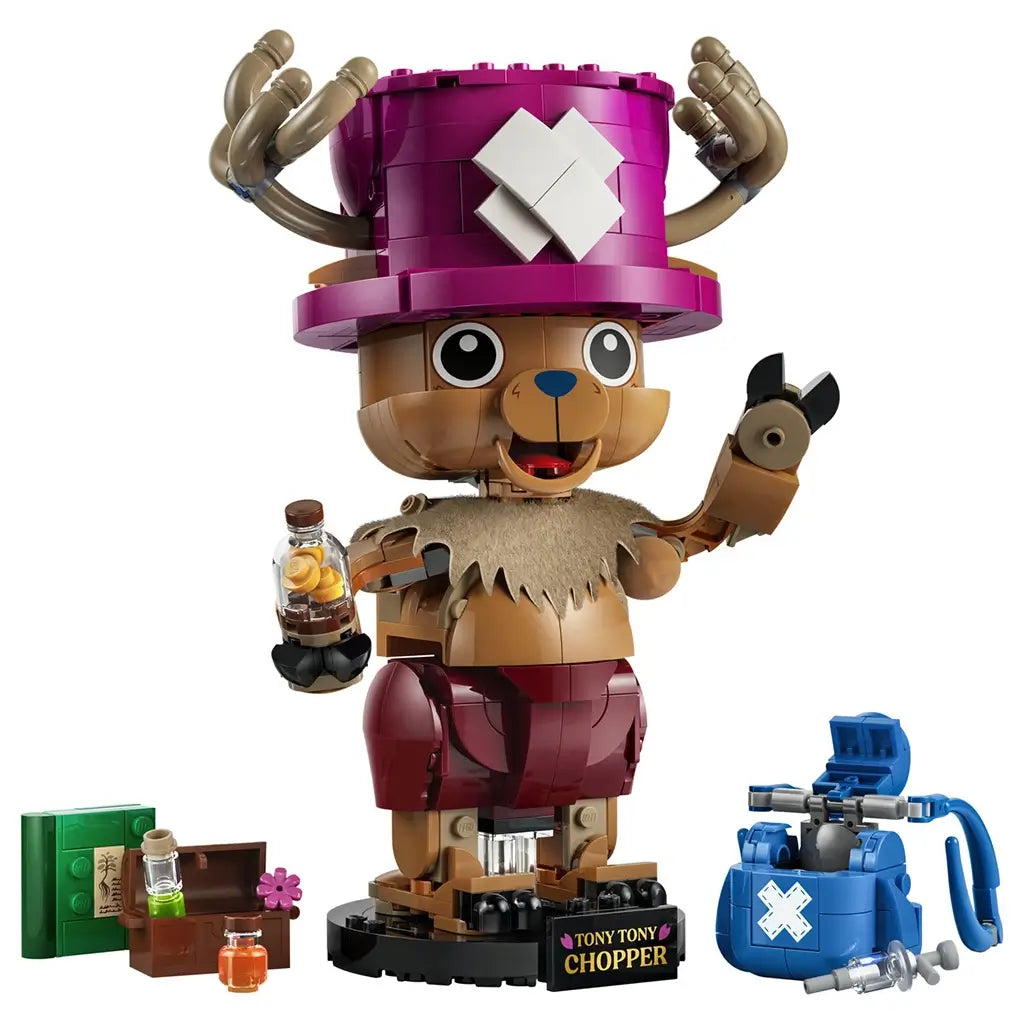 LEGO One Piece Tony Tony Chopper model features a brown brick-built figure with pink horned hat, red shorts, medicine bottle, blue backpack, book, and treasure chest.