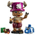 LEGO One Piece Tony Tony Chopper model features a brown brick-built figure with pink horned hat, red shorts, medicine bottle, blue backpack, book, and treasure chest.