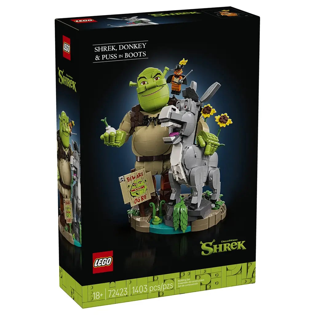 LEGO Shrek display set box features green Shrek, gray Donkey and orange Puss in Boots brick figures on a swamp base, with sunflowers and a Beware Ogre sign.