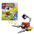 LEGO Sonic the Hedgehog Badnik Skorp building set featuring red, black, gray, and yellow plastic robot with drill arms and tail beside the branded 30733 foil pack on a clean white background.
