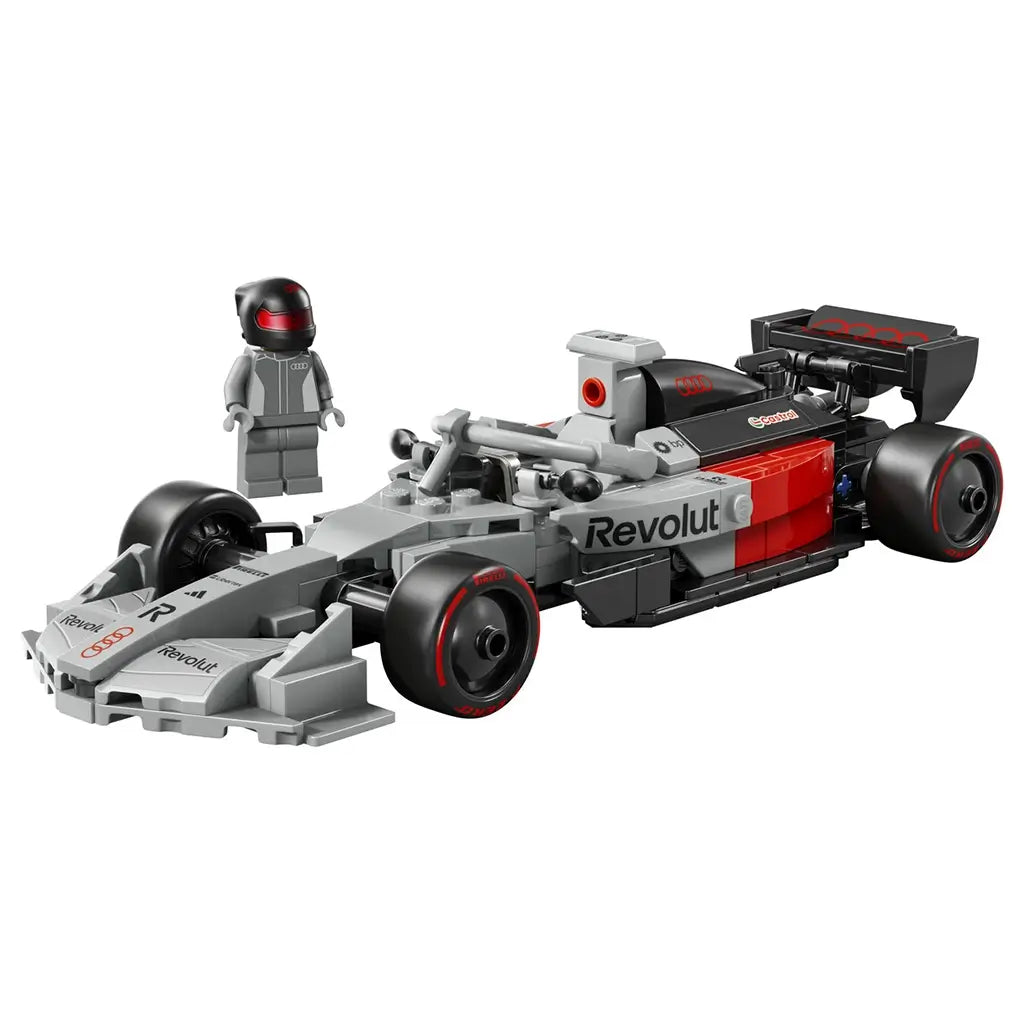 LEGO Audi Revolut F1 Team R26 race car in gray, black, and red plastic bricks, streamlined Formula 1 design with cockpit and sponsor decals, shown with minifigure on a white background.