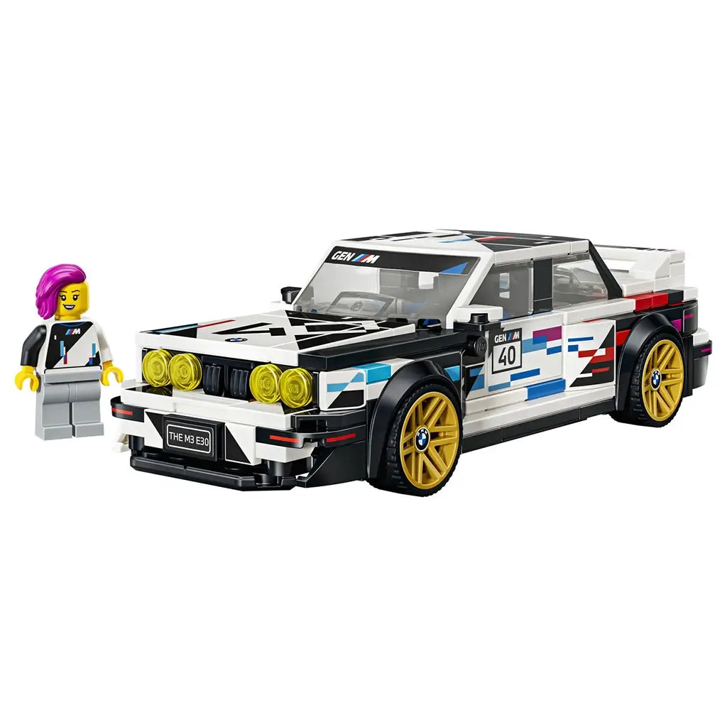 LEGO Speed Champions BMW M3 E30 in white, black and racing-color plastic features gold wheels, yellow headlights and a driver minifigure on a clean white background.