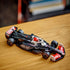 LEGO Speed Champions MoneyGram Haas F1 Team VF-24 black, red and white race car sits on a wooden tabletop, highlighting realistic Formula 1 styling in an indoor display with authentic sponsor graphics.