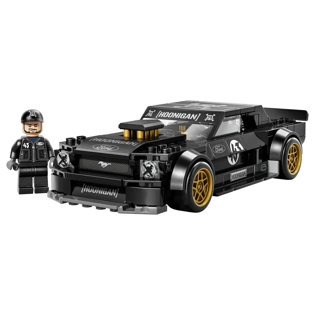 LEGO Speed Champions Ford Mustang Hoonicorn in black plastic features gold wheels, Hoonigan graphics, exposed intake and a driver minifigure on a white background.