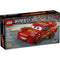 LEGO Speed Champions Lightning McQueen box front in black packaging, featuring the red race car model on a racetrack backdrop with Disney Pixar Cars branding, age rating, and piece count clearly visible