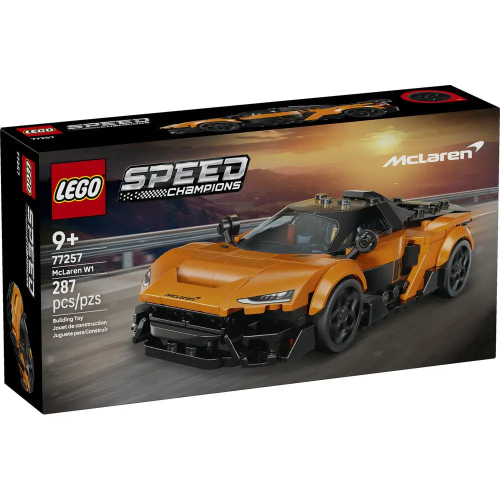 LEGO Speed Champions McLaren W1 box front in black packaging with racing imagery, showing the completed orange supercar model, McLaren branding, age recommendation, and piece count against a track backdrop