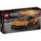 LEGO Speed Champions McLaren W1 box front in black packaging with racing imagery, showing the completed orange supercar model, McLaren branding, age recommendation, and piece count against a track backdrop