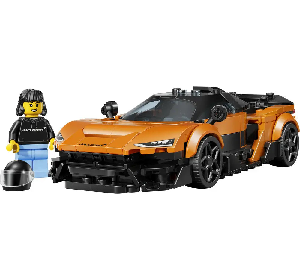 LEGO McLaren W1 supercar model in metallic orange and black plastic with smooth aerodynamic bodywork, low angular profile, detailed headlights, and racing wheels, displayed beside a McLaren-branded minifigure on a white background