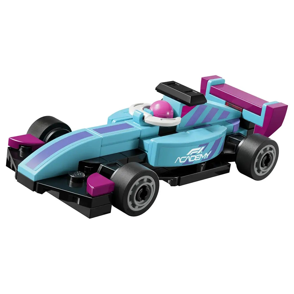 LEGO Speed Champions mini F1 car model features a light blue and purple plastic race car with black wheels, sleek low body, and open cockpit, representing a compact Formula-style vehicle, isolated on a clean white background for product display.