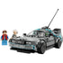 LEGO Back to the Future Time Machine DeLorean car in light gray plastic with angular body, translucent blue accents, rear-mounted reactor details, and extended antenna, displayed with Marty McFly and Doc Brown minifigures on a white background