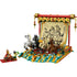 LEGO Spring Festival Galloping Horses Canvas display with red, gold, and teal plastic bricks forming four sculpted horses running across stylized waves before a hanging scroll artwork on a white studio background