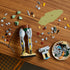 LEGO Star Wars Boba Fett 75455 set in green, gray, red and yellow plastic bricks, shown with the 1544-piece retail box, black blaster, display base, minifigure and plaque.