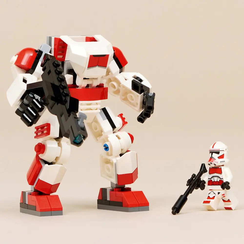 LEGO Star Wars Clone Shock Trooper mech displayed beside the included minifigure on a neutral surface, showing the mech’s height, armored design, large blaster, and red-accented feet.