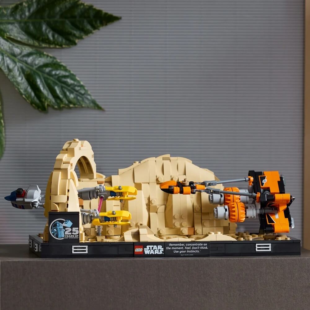 Image of LEGO® Star Wars™ Mos Espa Podrace™ Diorama 718 Piece Building Set (75380) with background of gray and trees