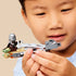 LEGO Star Wars speeder bike play scene with gray and tan plastic pieces, shown in a child’s hands while assembling parts, emphasizing hands-on construction, focus, and imaginative indoor play.