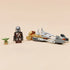 LEGO Star Wars Mandalorian speeder bike model in gray and tan plastic fully assembled, displayed with The Mandalorian and Grogu minifigures standing beside it on a smooth neutral tabletop.